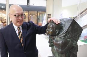 長崎の商店街見守る「政どん」　市民らに愛され、時代とともに変化