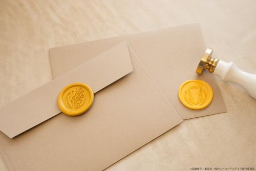 封筒に黄色いシーリングスタンプを添えた使用例